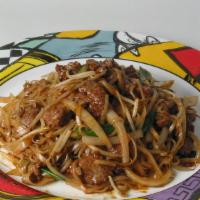 Beef Chow Fun · Rice noodles sautéed with sliced beef, bean sprouts, scallions, and onions.