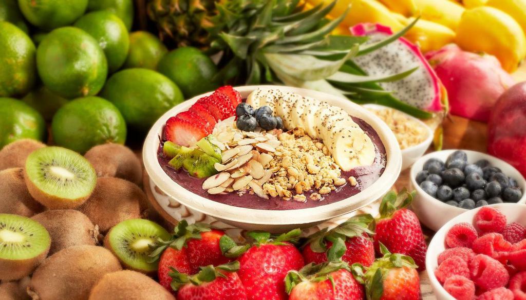 Acai Bowl · Organic blend of acai, strawberry, blueberry and banana, topped with granola, coconut flakes, kiwi, blueberries, strawberries, banana and chia seeds.