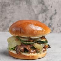 Grilled Steak · Dry Rubbed Grilled Eye Round Steak Topped w/ Swiss Cheese, Grilled Onion, Squash, Spring Mix...