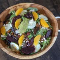 Roasted Beet Salad · Spring Mix Salad w/ Herb Roasted Red Beets, Feta Cheese, Toasted Nuts and Seeds, Orange Supr...