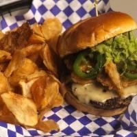 Guacamole Burger · Topped with Ghost Pepper cheese, guacamole, jalapeños, and fried onion straws