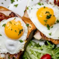 Open Face Breakfast Sandwich · Brioche bread, ham, bacon, Swiss cheese, fried eggs and Swiss cheese.