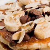 Chocolate Chip Pancake · Banana, almonds, drizzled with maple syrup.