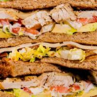 Chicken Club Sandwich · Sliced multi-grain bread, Swiss cheese, bacon, tomato, avocado, lettuce, and aioli dressing.