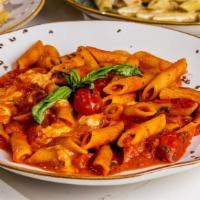 Tomato Basil · Penne with tomato sauce, mozzarella, basil and cheery tomatoes.