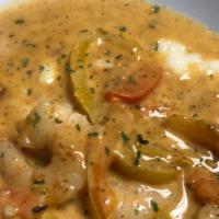 Southern Style Shrimp & Grits · Shrimp sautéed with onions, red, and green bell peppers with a creamy creole sauce served ov...