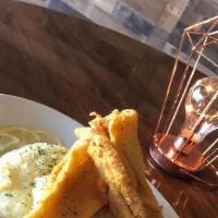 Crispy Flounder Filets (Two Pcs) Over Cheese Grits · 