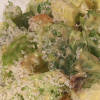 Cesaare · Crispy romaine lettuce with croutons, bacon, homemade cream dressing, topped with parmigiano...