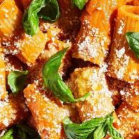 Mezzi Paccheri Al Vodka · Imported short Italian pasta in a fresh tomatoes sauce, bacon, mushrooms, vodka, a touch of ...