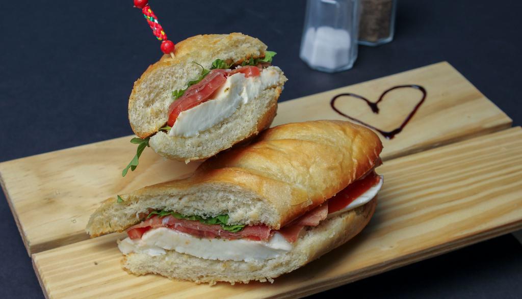 Italian Sandwich · Prosciutto, fresh mozzarella, tomato, pesto and arugula.