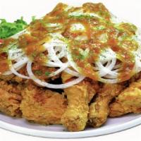 Curry Snow Onion Whole Chicken · Crispy fried chicken with our signature sweet curry sauce on sliced sweet onions