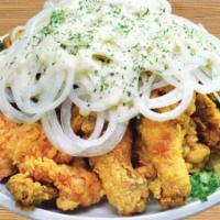 Hot Snow Onion Tenders · Crispy fried chicken tenders with our signature spicy and fresh green hot sauce on sliced sw...