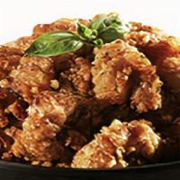 Tikku Soy Sauce Gizzard · Fried then charcoal oven baked chicken gizzards tossed in a sweet and savory garlic soy glaze