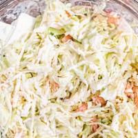 Coleslaw · Fresh shredded cabbage and carrots tossed in coleslaw dressing