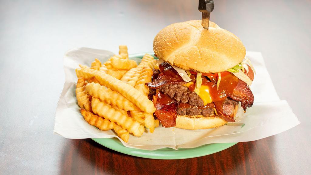 Legion Burger · Double patty, double bacon, double cheese, pickles.  lettuce and  tomato burger with sweet & tangy sauce sprinkled with lemon pepper and toasted kiser bun