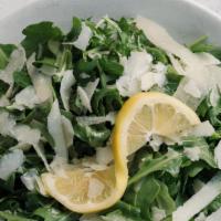 Arugula Salad · Wild arugula, shaved pecorino, lemon infused olive oil from sorrento, a squeeze from a fresh...
