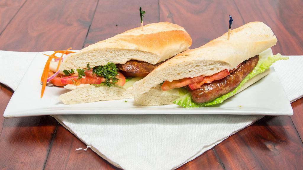 Choripan · Grilled sausage on baguette.
