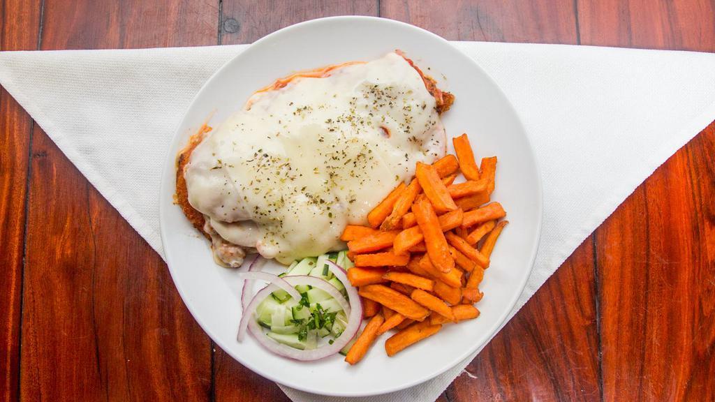 Milanesa Napolitana · Thin cut breaded beef or chicken with tomato, melted cheese.