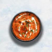 Butter Chicken  · Grilled chicken morsels braised in a tomato and butter gravy, seasoned with aromatic herbs.