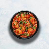 Chicken Curry · Boneless chicken cooked in Indian style with ginger, garlic, onion and tomato masala.