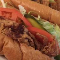 Shrimp Po-Boy · All po-boy served on our fresh french bread. dressed with mayonnaise -lettuce tomato and pic...