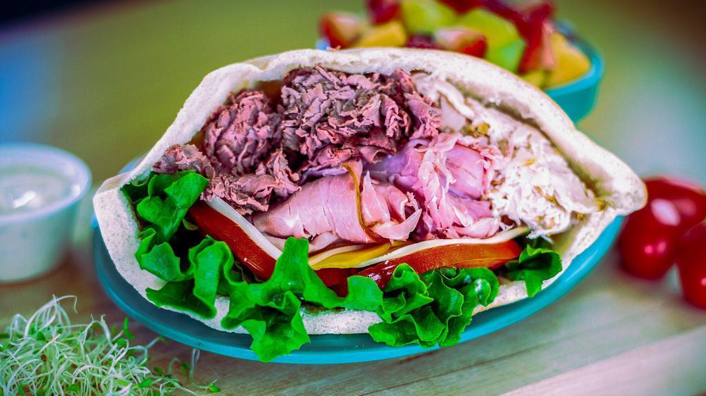 Triple Pita * · Turkey, Ham & Roast Beef in a Pita with Swiss, Cheddar & Provolone, Lettuce, Tomato & Mayo. Served with your choice of Side Item and a Pickle Spear.