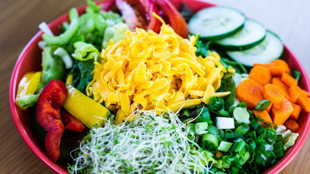 Big Green * · A Fresh Garden Salad with Cheddar Cheese, Roma Tomatoes, Bell Peppers, Carrots, Celery, Alfalfa Sprouts, Green Onions & Cucumbers served with your choice of Salad Dressing. Add your selection of Protein for a Custom Salad!
