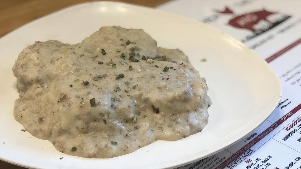 Biscuits & Gravy · Two homemade biscuits, split open topped with country style homemade sausage gravy.