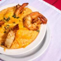 Shrimps & Grits · Southern style cheese grits, topped with cajun sauté shrimp.