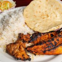 Cerdo Asado · Grilled pork served with either rice or gallo pinto (rice with red beans combined), comes wi...