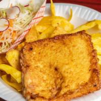 Tajadas Con Queso Frito · Fried green plantains with fried cheese and coleslaw.