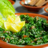Tabbouleh Salad · Chopped parsley, bulgur wheat, tomatoes, onion, mixed with a minty blend of lemon, and extra...