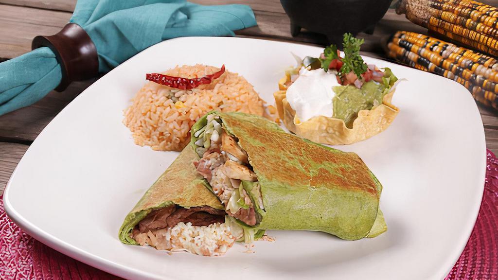 Burrito Wrap · A spinach flour tortilla stuffed with your choice of steak or chicken, beans, lettuce, rice, pico de gallo and shredded cheese. Served with rice, guacamole, pico de gallo and sour cream.