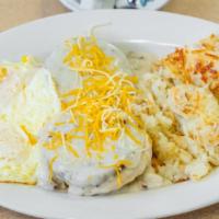 Smothered Biscuit · One open faced biscuit, two sausage patties, sausage gravy, shredded cheese, served with has...