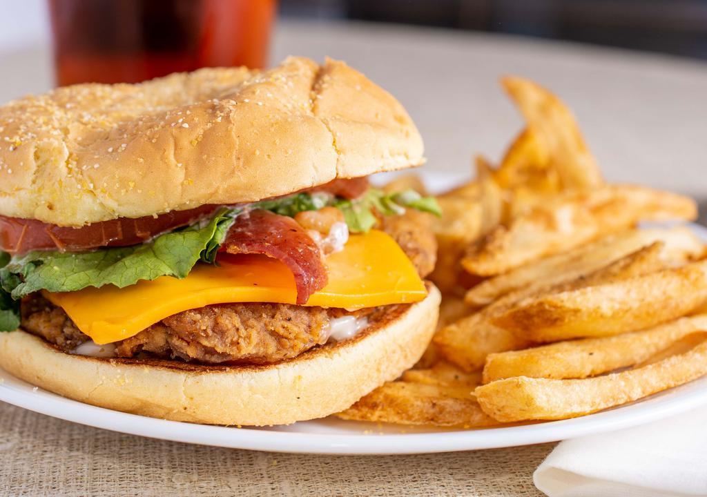 Cajun Filet Club Sandwich (Combo) · A uniquely seasoned chicken breast filet, American cheese, hardwood-smoked bacon, lettuce, tomato and mayo on a lightly toasted bun, served with your choice of a home-style fixin and a drink. 820 - 1,530 Cal.
