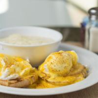 Classic Eggs Benedict · Two poached eggs, Canadian bacon topped with hollandaise on a toasted whole wheat English mu...