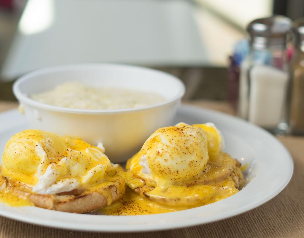 Classic Eggs Benedict · Two poached eggs, Canadian bacon topped with hollandaise on a toasted whole wheat English muffin