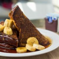 Peanut Butter French Toast · Challah bread filled with peanut butter, dipped in batter, encrusted with bran flakes and to...