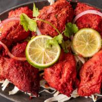 Tandoori Chicken (6) · Chicken marinated overnight in yogurt, fresh spices and lemon juices then barbecued in tando...