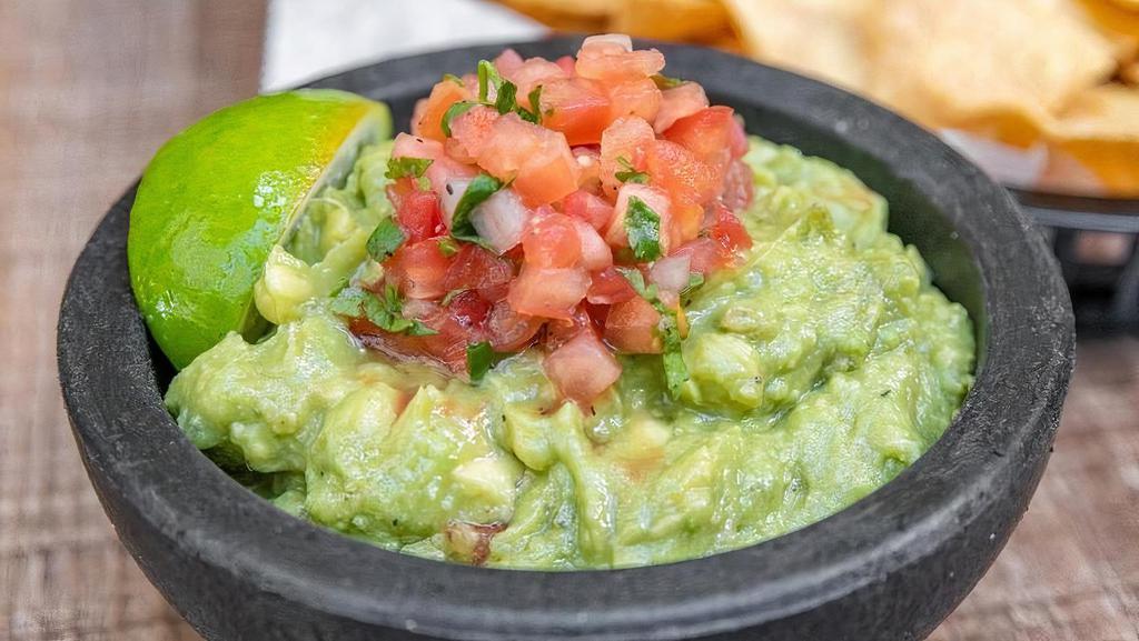 Guacamole And Chips (Gluten Free/Vegan) · Fresh homemade guacamole with bass avocados, onions, cilantro and pico. served with freshly fried homemade chips.
