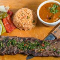 Table Churrasco · A generous tender and juicy skirt steak with a side of a Mexican rice, charro beans and gill...