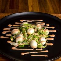 Huevitos De Codorniz (Quail Eggs) · Eight exotic quail eggs served on a bed of fresh lettuce, garnished with a slick touch of pi...