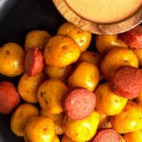 Salchipapa Criolla · Deep Fry Colombian Yellow potatoes Mix  with Nathan's Famous Premium Beef Sausage bites!