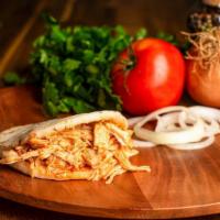Arepa Con Pollo · Arepa stuffed with deliciously shredded chicken breast with Colombian Hogao!