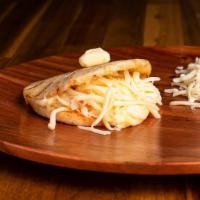 Arepa Con Queso · Arepa stuffed with deliciously creamy and soft melted Mozzarella cheese