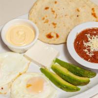 Desayuno Catracho / Typical Honduran Breakfast · Huevos, frijoles fritos, tortilla de harina O maiz, queso y mantequilla / eggs, fried beans,...