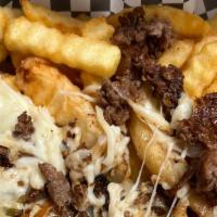 Loaded Philly Cheese Steak Fries · Philly cheese steak with vegetables served over french fries, and then drizzed with ranch.
b...
