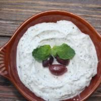 Garlic Labne · The tangy Mediterranean strained yogurt with a hint of garlic and mint.