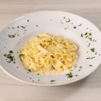 Fettuccine Alfredo · Egg pasta, cream, parmesan cheese and butter.