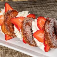 Strawberries And Cream Sandwich · Layered donut sandwich with a whipped cream and fresh strawberries.